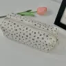 Бежевый с чёрными цветками